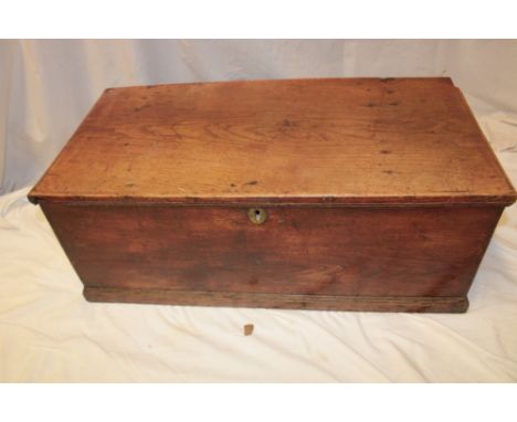 A small 19th century elm rectangular trunk with internal candle box enclosed by a hinged lid, 30" long