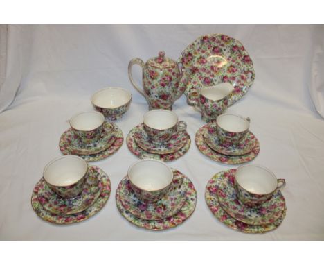 A Royal Winton china chintz pattern coffee set comprising tapered coffee pot, milk jug, sugar basin, six coffee cups, six sau