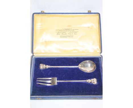An Indian  silver anointing-style spoon and fork with elephant decorated handles in velvet lined maker's case by Grish Chunde