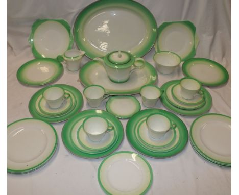 A 1930s Art Deco part  tea and dinner set by Shelley with green tinted edges comprising six angular tea cups, four saucers, t