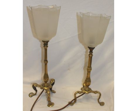 Two old brass adapted table lamps with opaque glass shades and tripod scroll legs, 17" high