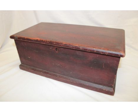 A 19th century stained pine miniature trunk/blanket box with internal candle fitment enclosed by a hinged lid, 19" long x 8" 