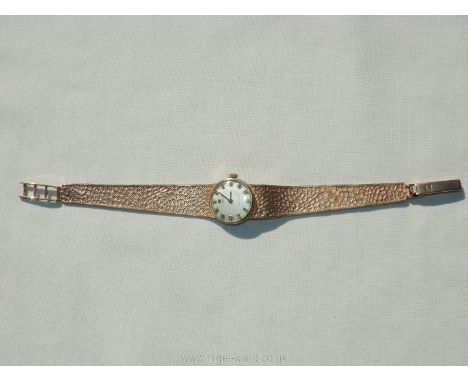 A Harrods presentation cased Tissot Stylist Cardy's wrist watch having a 9ct gold wristlet, running at the time of cataloguin