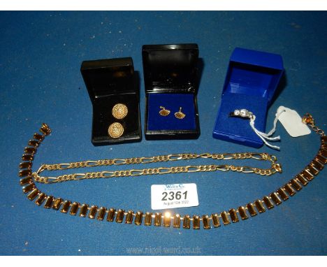 A small quantity of jewellery to include; a pair of 9ct gold fan shaped earrings, a dress ring with 3 white stones, clip on e