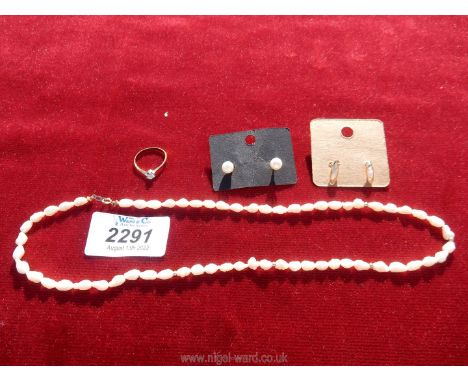 A rice pearl beaded necklace with 14k clasp and matching stud pearl earrings with 375k post, and a rolled gold ring.