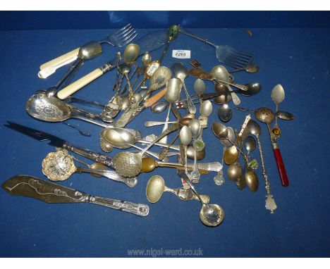 A small quantity of flatware including enamel souvenir spoons, fish servers, Mappin &amp; Webb sugar tongs, etc.