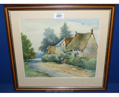 A framed and mounted watercolour depicting cottages and two ladies talking over a garden gate, no visible signature.