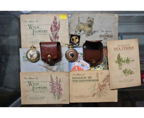 Collection of cigarette cards in albums and two Franklin Mint pocket watches in leather pouches