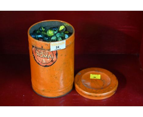 Vintage tin containing marbles