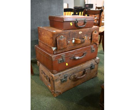 Four vintage suitcases