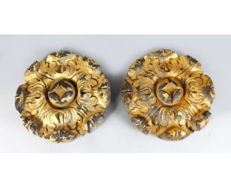 AN UNUSUAL PAIR OF 19TH CENTURY CAST IRON ARCHITECTURAL BOSSES, of flower head form. 1ft 4ins diameter.