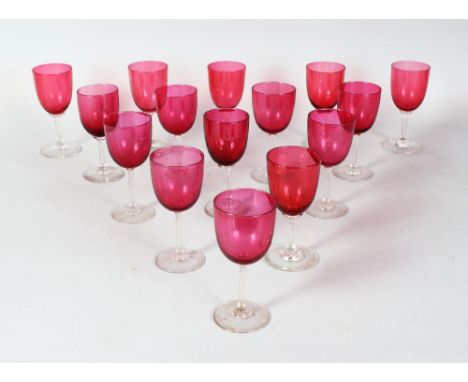 A NEAR SET OF FOURTEEN RUBY GLASS WINE GLASSES.