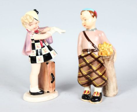 A PAIR OF GOLDSCHEIDER FIGURES, BOY WITH GOLF CLUBS AND GIRL PUTTING ON GLOVES. 7.5ins high.