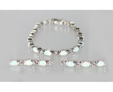 A SILVER GILSON OPAL LINE BRACELET AND EARRINGS.