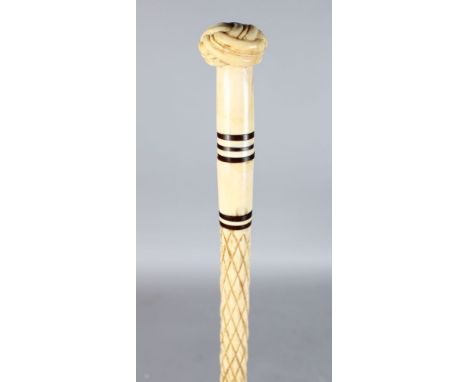 A 19TH CENTURY MARINE IVORY WALKING STICK, POSSIBLY NORTH AMERICAN. The handle carved with a Turks head knot, the upper half 