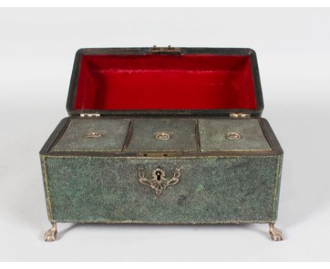 A RARE GEORGE III SHAGREEN THREE DIVISION TEA CADDY, with silver mounts and claw and ball feet. 10ins long.