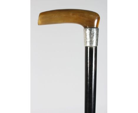 A WALKING STICK WITH RHINO HANDLE, and silver band.