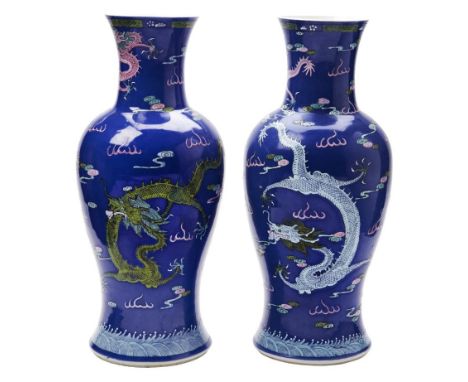 PAIR OF POWDER BLUE-GROUND FAMILLE ROSE ENAMEL DECORATED 'DRAGON' VASES QING DYNASTY, 19TH CENTURY the baluster sides decorat