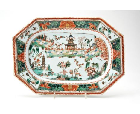 FAMILLE VERTE OCTAGONAL DISHKANGXI PERIODpainted with pagodas in walled gardens within a band of birds and peony36cm wide