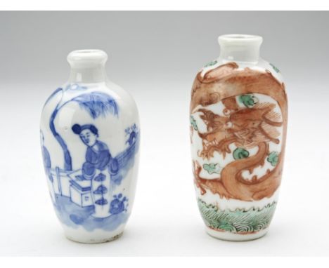 TWO PORCELAIN SNUFF BOTTLES LATE QING DYNASTY comprising one blue and white, and the decorated with an iron-red dragon, apocr