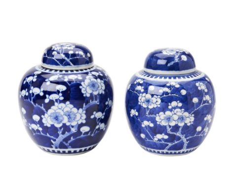 TWO 'CRACKED-ICE AND PRUNUS' BLUE AND WHITE GINGER JARS AND COVERS  KANGXI FOUR CHARACTER MARKS BUT LATER QING DYNASTY 15.5cm