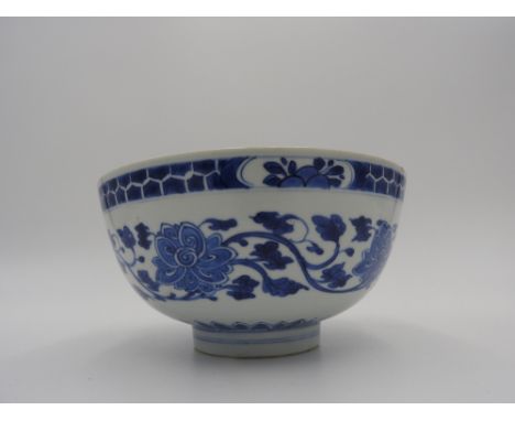 BLUE AND WHITE 'FISH AND LOTUS' BOWL KANGXI PERIOD painted in tones of cobalt blue with meandering lotus blossom, the interio
