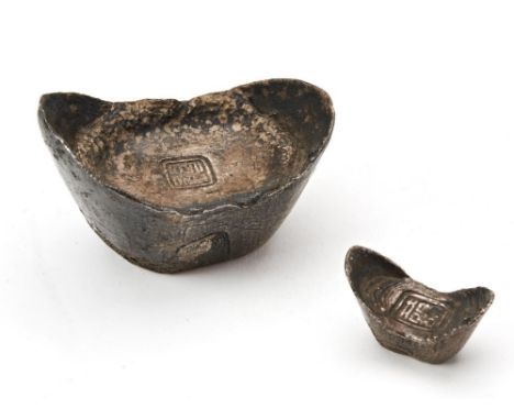 TWO CHINESE SILVER INGOTS of boats shape form, with impressed seal marks 6.5cm and 3cm wide, PROVENANCE: Private Somerset col