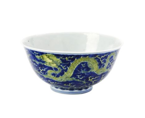 UNDERGLAZE-BLUE AND YELLOW ENAMEL 'DRAGON' BOWL KANGXI SIX CHARACTER MARK AND OF THE PERIOD painted with two five-clawed drag