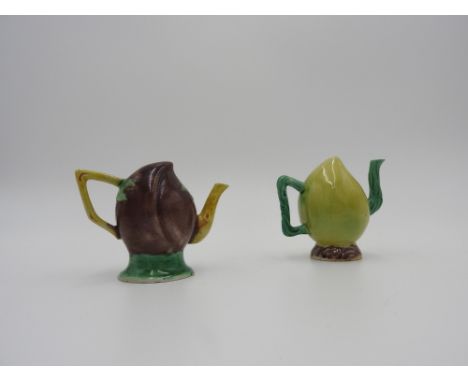 TWO SANCAI-GLAZED WATER DROPPERS QING DYNASTY of fruit form; together with a BLANCE-DE-CHINE BUDDHIST LION, KANGXI PERIOD, AN