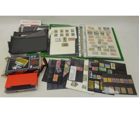 Collection of maily QEII New Zealand stamps incl. definitives, some mint in stock book & loose and a UV lamp Condition Report