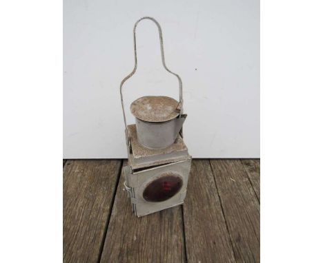 A railway tail lamp with reservoir and burner 
