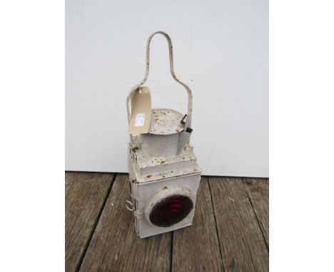 A railway tail lamp with reservoir and burner 