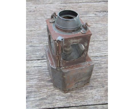 A railway lamp with brass burner and oversized reservoir, stamped "NORWICH THORPE"