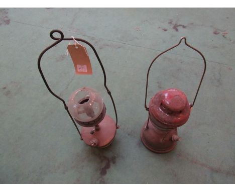 A Tilley lamp by R.W.I. Bullard and a railway waiting room ceiling hanging oil lamp (2 a/f)