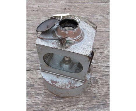 A railway dock side signal lamp with convex corrugated clear glass front aspect 