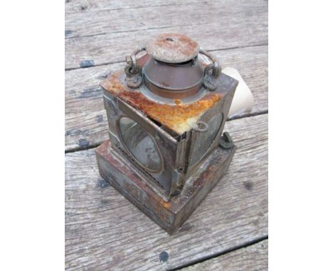 An LNER railway signal lamp interior with reservoir and burner, stamped "SAXMUNDHAM"