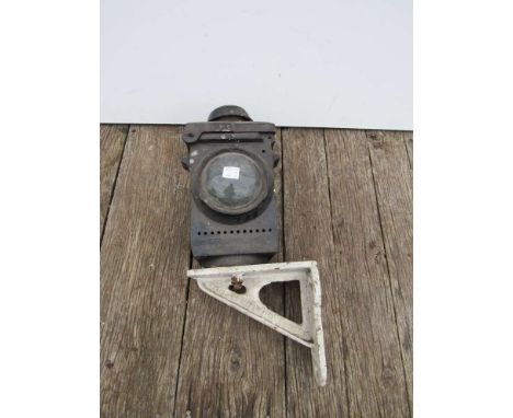An LNER black painted signal lamp case on bracket and a cast iron lamp case finial stamped GER