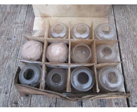 A quantity of tilley lamp glass globes, original labels 