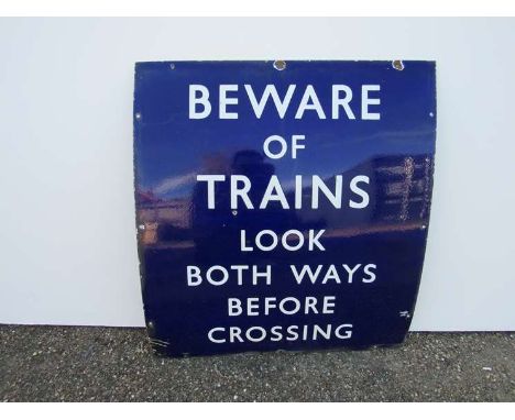 A B.R (E) enamel crossing sign "BEWARE OF TRAINS LOOK BOTH WAYS BEFORE CROSSING", 69cm x 77cm