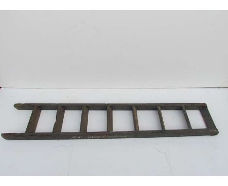 A wooden railway station ladder painted "B.R Framlingham"