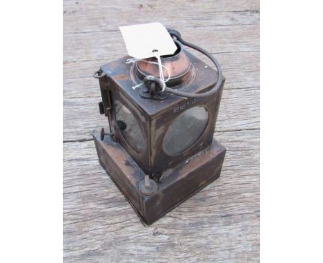 A railway signal lamp interior with reservoir and brass burner 