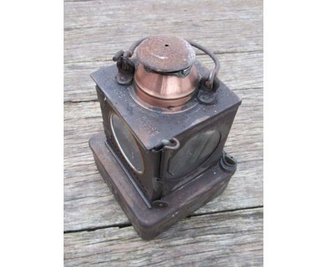 Two railway signal lamp interiors with brass burners, one stamped LNER and the other un-marked