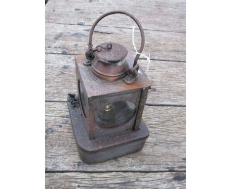 An LNER railway signal lamp interior with reservoir and brass burner 