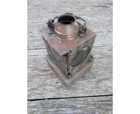 A railway signal lamp interior with reservoir and brass burner, stamped "IPSWICH" 