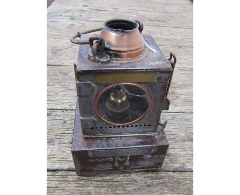 An LNER railway signal lamp interior with reservoir and brass burner stamped FRAMLINGHAM