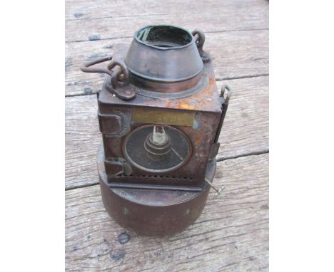 A railway signal lamp interior with reservoir and ceramic burner (lid missing)
