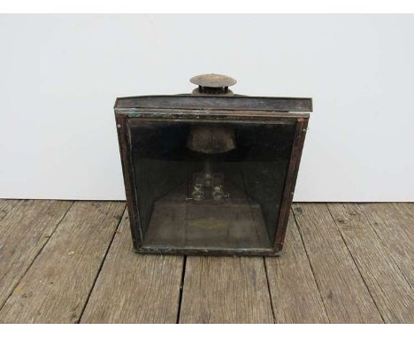 A metal cased 'Adlake' non-sweating large railway yard lamp with reservoir and triple burners