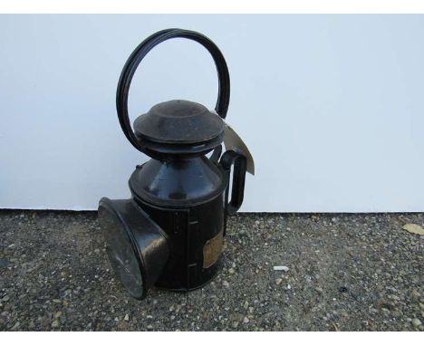 An LNER railwayman's hand lamp with ceramic burner stamped "IPSWICH PASS", painted black, glass aspect damaged 