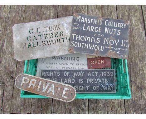 A tray containing six various cast iron and enamel signs to include "WICKHAM MARKET &amp; SOUTHWOLD" advertising