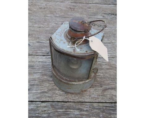 A railway dockside signal lamp with convex clear glass front aspect 